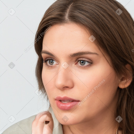 Neutral white young-adult female with long  brown hair and brown eyes