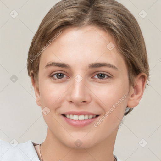 Joyful white young-adult female with short  brown hair and brown eyes