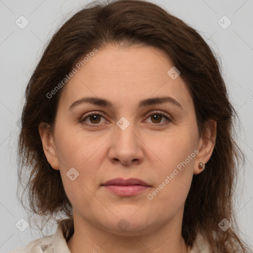 Joyful white adult female with medium  brown hair and brown eyes