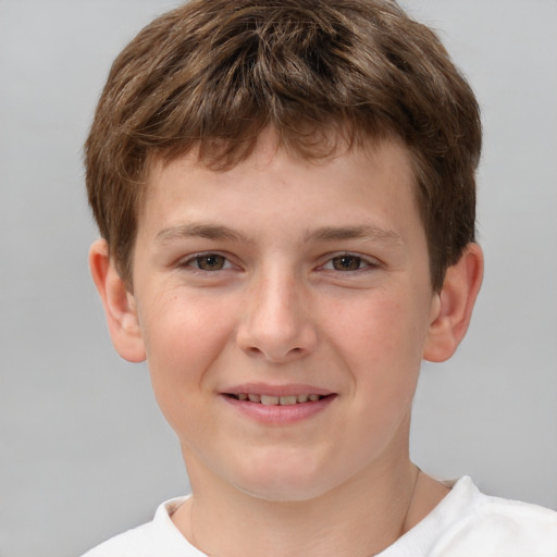 Joyful white child male with short  brown hair and brown eyes