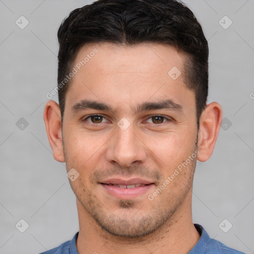 Joyful white young-adult male with short  brown hair and brown eyes