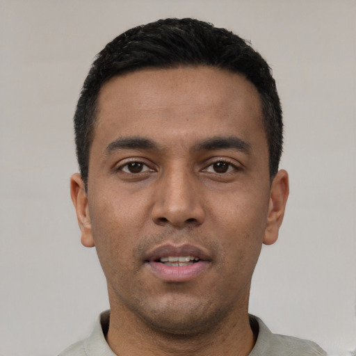 Neutral latino young-adult male with short  black hair and brown eyes