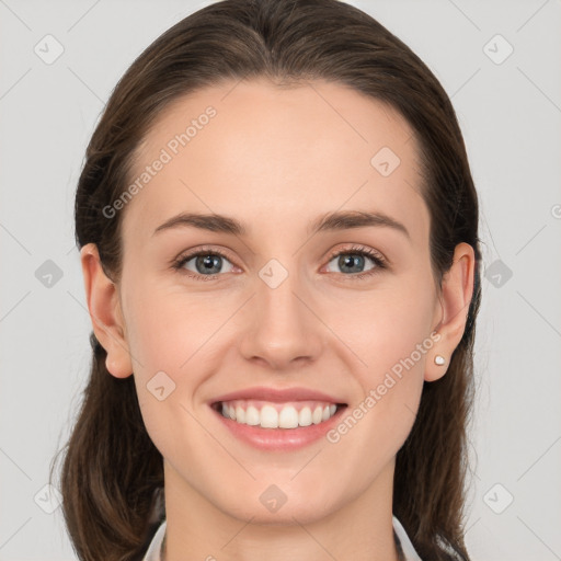 Joyful white young-adult female with medium  brown hair and grey eyes