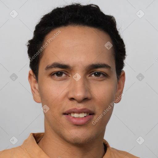 Joyful white young-adult male with short  black hair and brown eyes