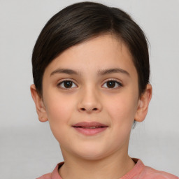 Joyful white child female with short  brown hair and brown eyes