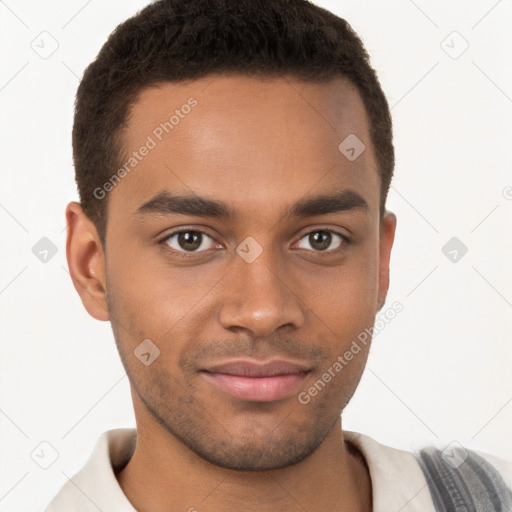 Joyful black young-adult male with short  brown hair and brown eyes