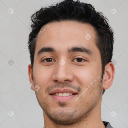 Joyful white young-adult male with short  black hair and brown eyes