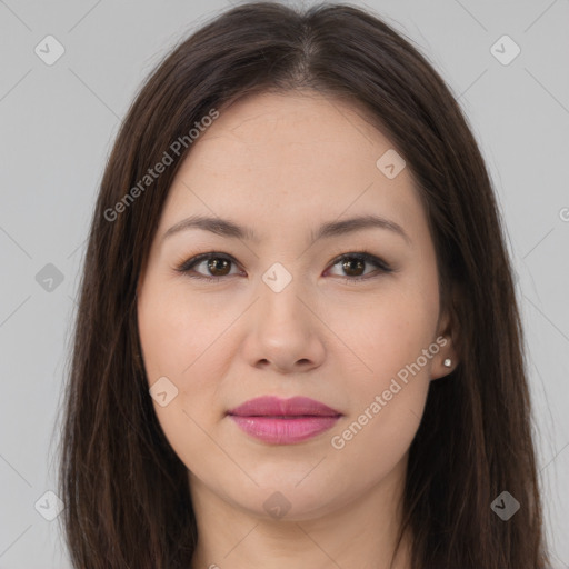 Joyful asian young-adult female with long  brown hair and brown eyes