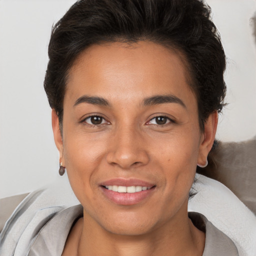 Joyful white young-adult female with short  brown hair and brown eyes