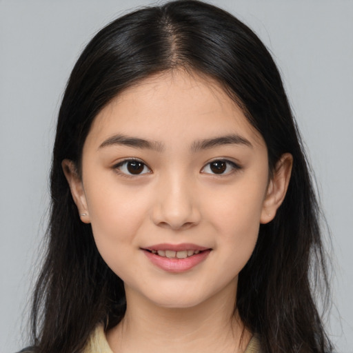 Joyful asian young-adult female with long  brown hair and brown eyes