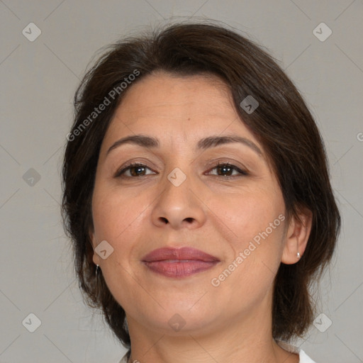 Joyful white adult female with medium  brown hair and brown eyes