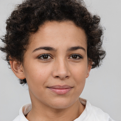 Joyful latino young-adult female with short  brown hair and brown eyes