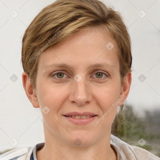 Joyful white adult female with short  brown hair and grey eyes