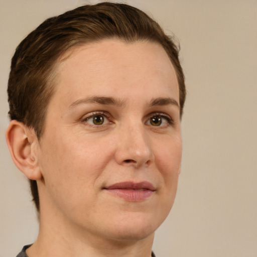 Joyful white adult female with short  brown hair and brown eyes