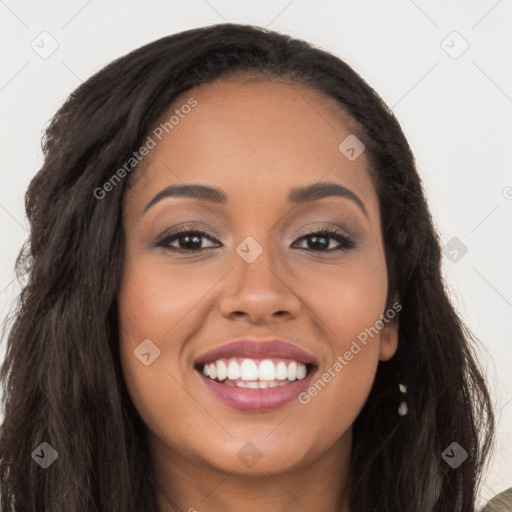 Joyful latino young-adult female with long  brown hair and brown eyes