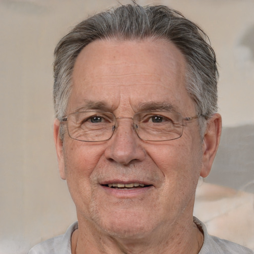 Joyful white middle-aged male with short  gray hair and brown eyes