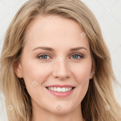 Joyful white young-adult female with long  brown hair and blue eyes