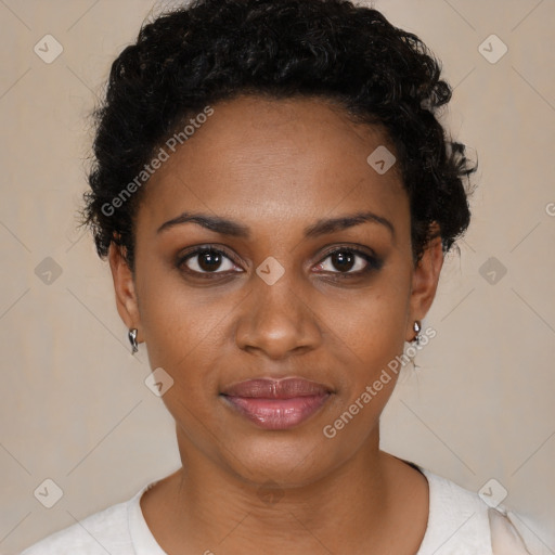 Joyful black young-adult female with short  black hair and brown eyes