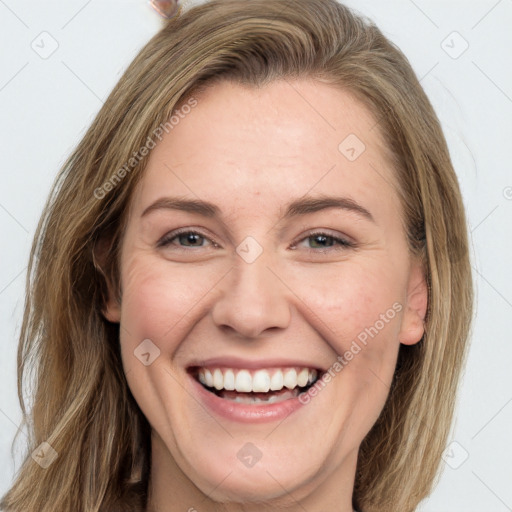 Joyful white young-adult female with long  brown hair and grey eyes