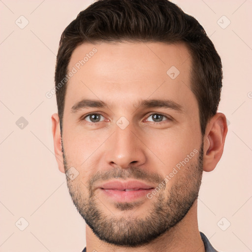 Joyful white young-adult male with short  brown hair and brown eyes