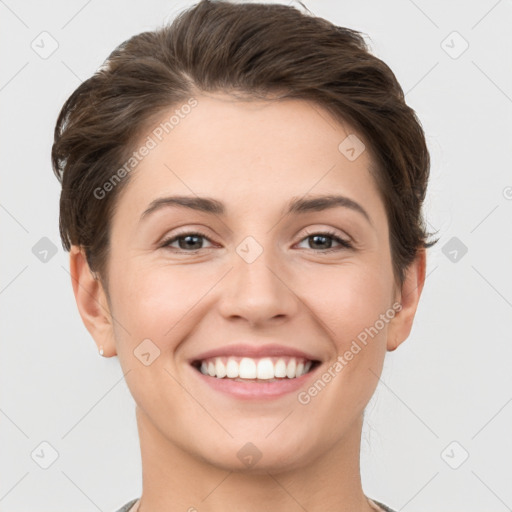 Joyful white young-adult female with short  brown hair and grey eyes