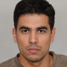 Neutral white young-adult male with short  black hair and brown eyes
