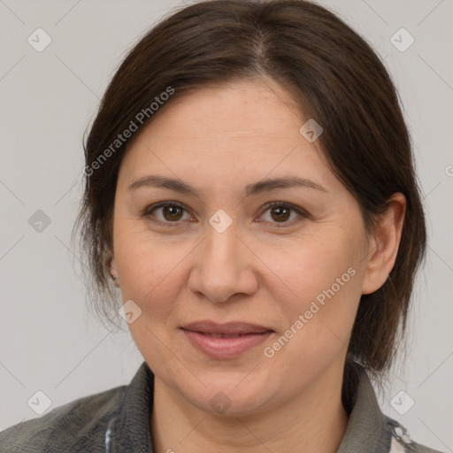 Joyful white adult female with medium  brown hair and brown eyes