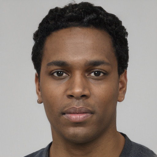 Neutral black young-adult male with short  black hair and brown eyes