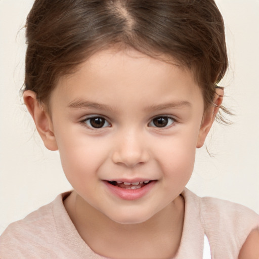 Joyful white child female with short  brown hair and brown eyes