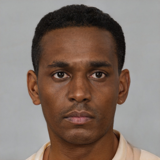 Neutral black young-adult male with short  black hair and brown eyes