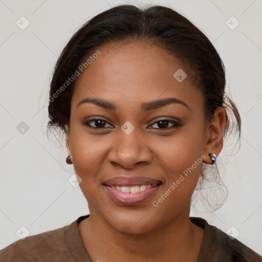 Joyful black young-adult female with medium  brown hair and brown eyes