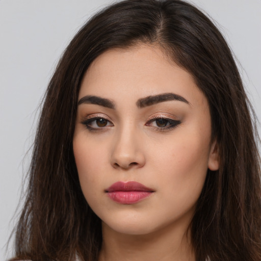Neutral white young-adult female with long  brown hair and brown eyes