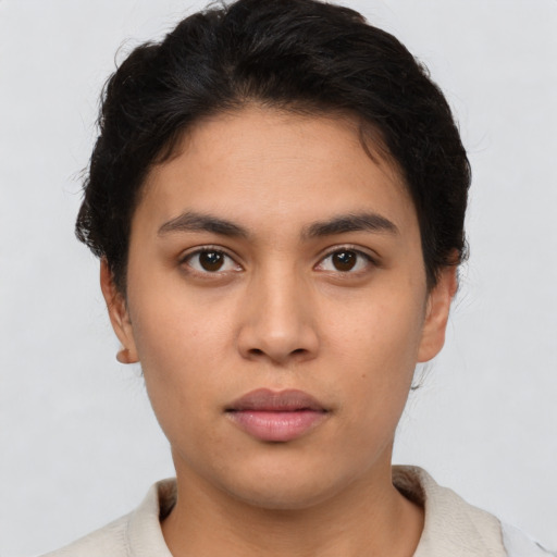 Neutral latino young-adult female with short  brown hair and brown eyes