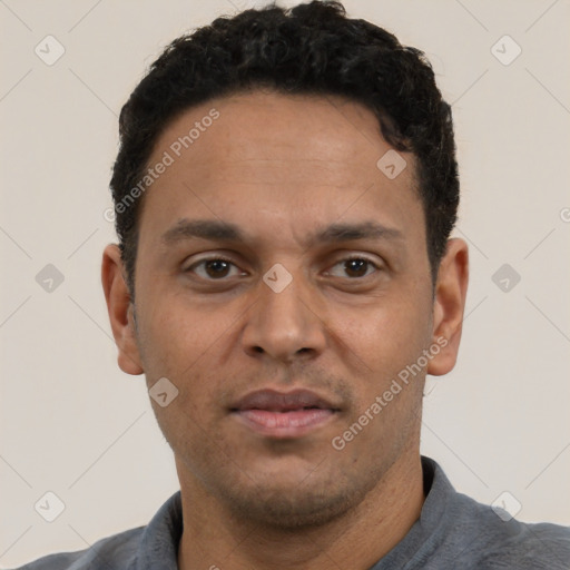 Neutral latino adult male with short  black hair and brown eyes