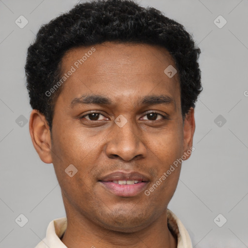 Joyful black young-adult male with short  brown hair and brown eyes