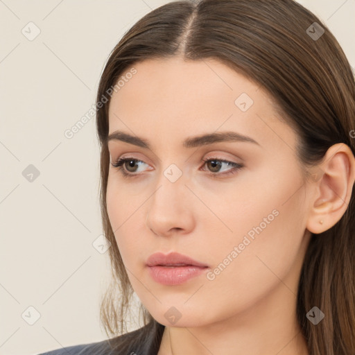 Neutral white young-adult female with long  brown hair and brown eyes