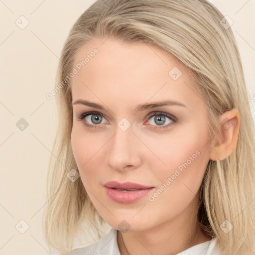 Joyful white young-adult female with long  brown hair and blue eyes