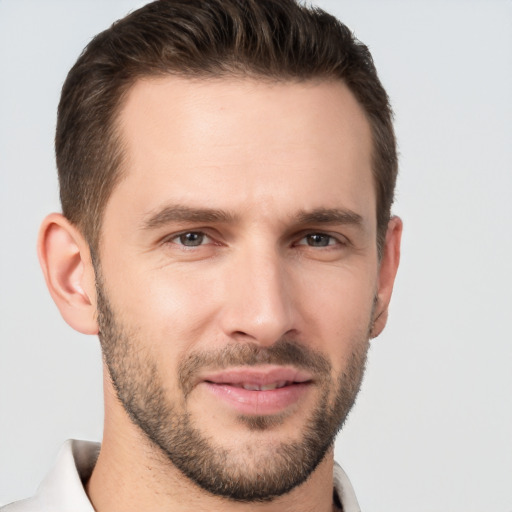 Joyful white young-adult male with short  brown hair and brown eyes