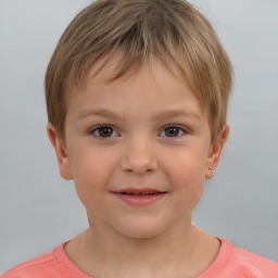 Joyful white child male with short  brown hair and brown eyes