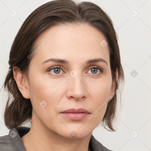 Neutral white young-adult female with medium  brown hair and grey eyes