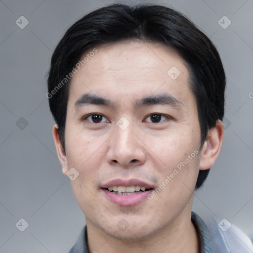 Joyful white young-adult male with short  black hair and brown eyes