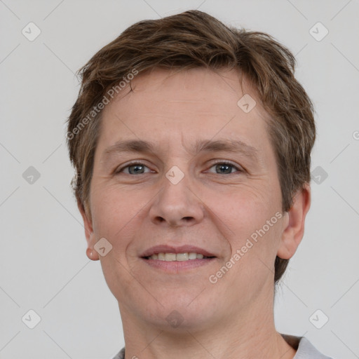 Joyful white adult male with short  brown hair and grey eyes