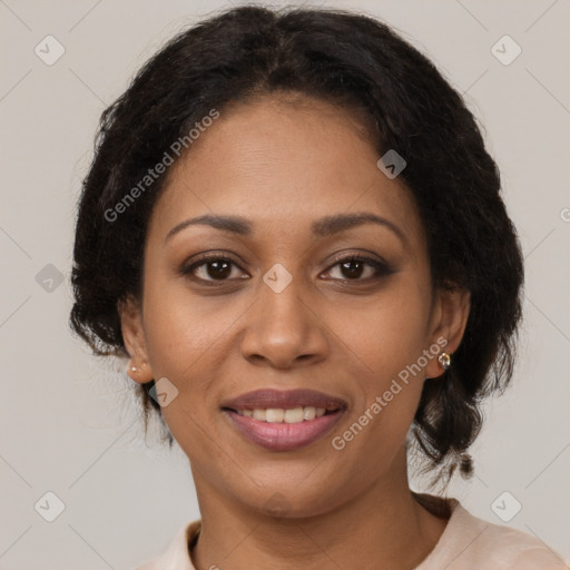 Joyful black young-adult female with medium  brown hair and brown eyes