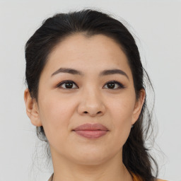 Joyful asian young-adult female with medium  brown hair and brown eyes