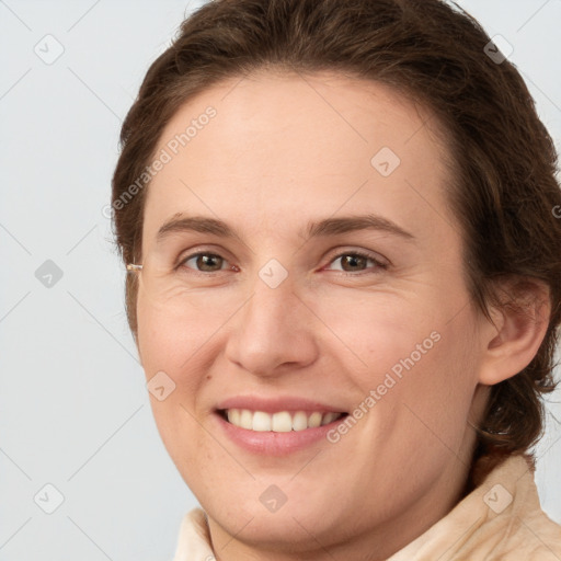 Joyful white young-adult female with medium  brown hair and grey eyes