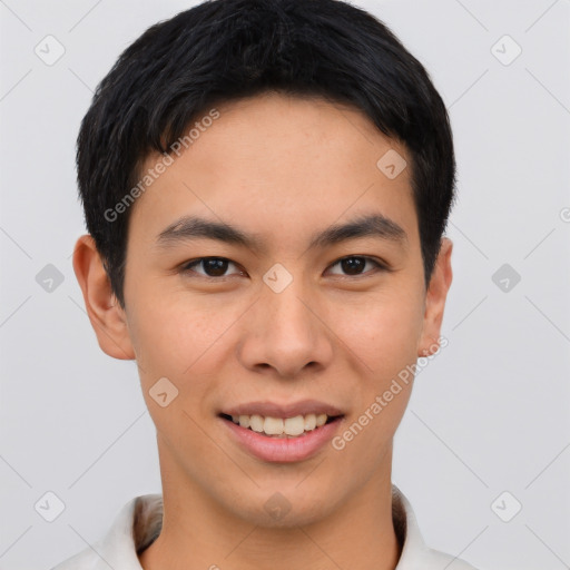 Joyful asian young-adult male with short  brown hair and brown eyes