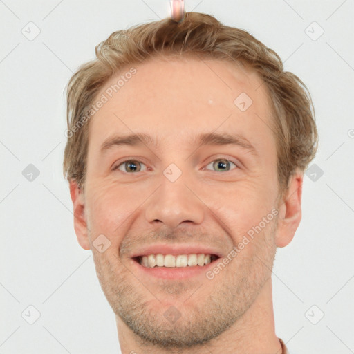 Joyful white adult male with short  brown hair and grey eyes