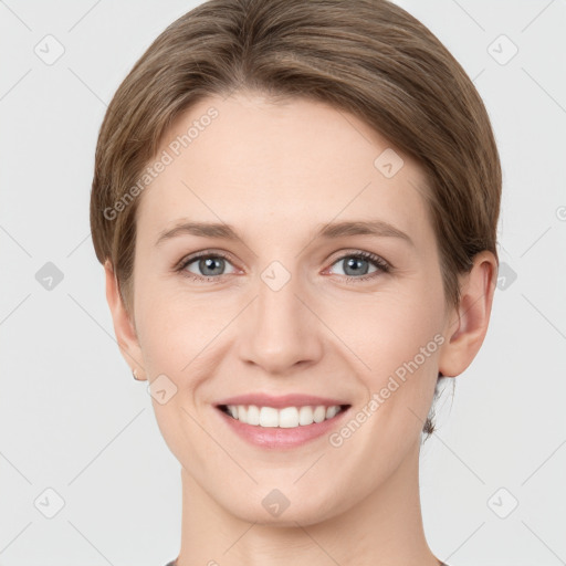 Joyful white young-adult female with short  brown hair and grey eyes