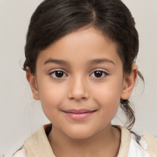 Joyful white child female with medium  brown hair and brown eyes