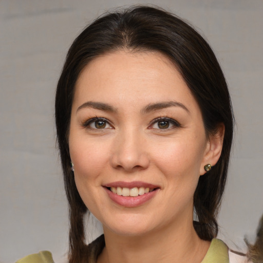 Joyful white young-adult female with medium  brown hair and brown eyes